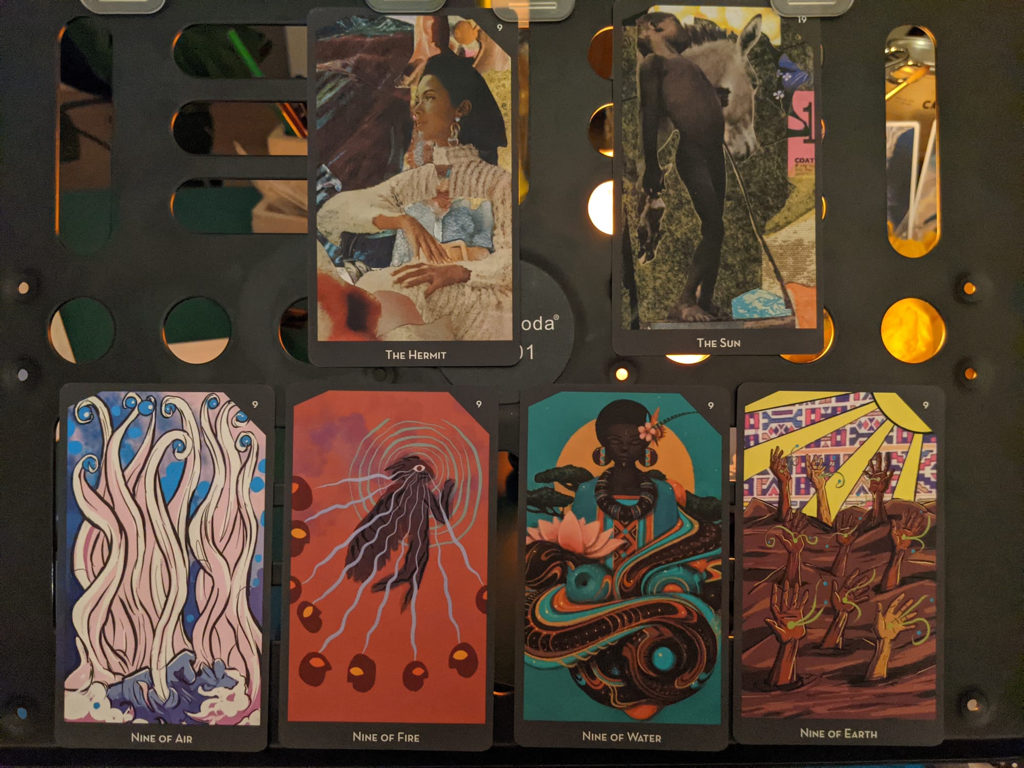 The Hermit, The Sun and Nine of Air, Fire, Water and Earth Tarot cards from Lineages of Change Tarot, AK Press