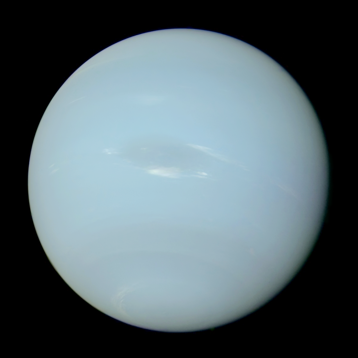 faint blue glossy cloudy surface of planet Neptune set against a black background